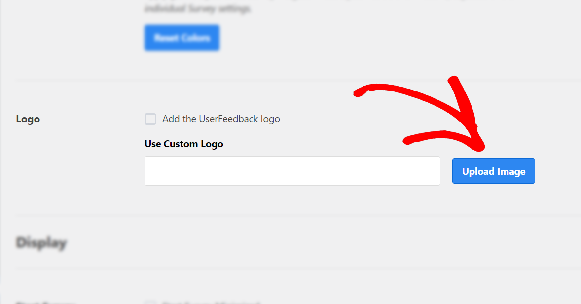 red arrow pointing out upload button within custom logo settings